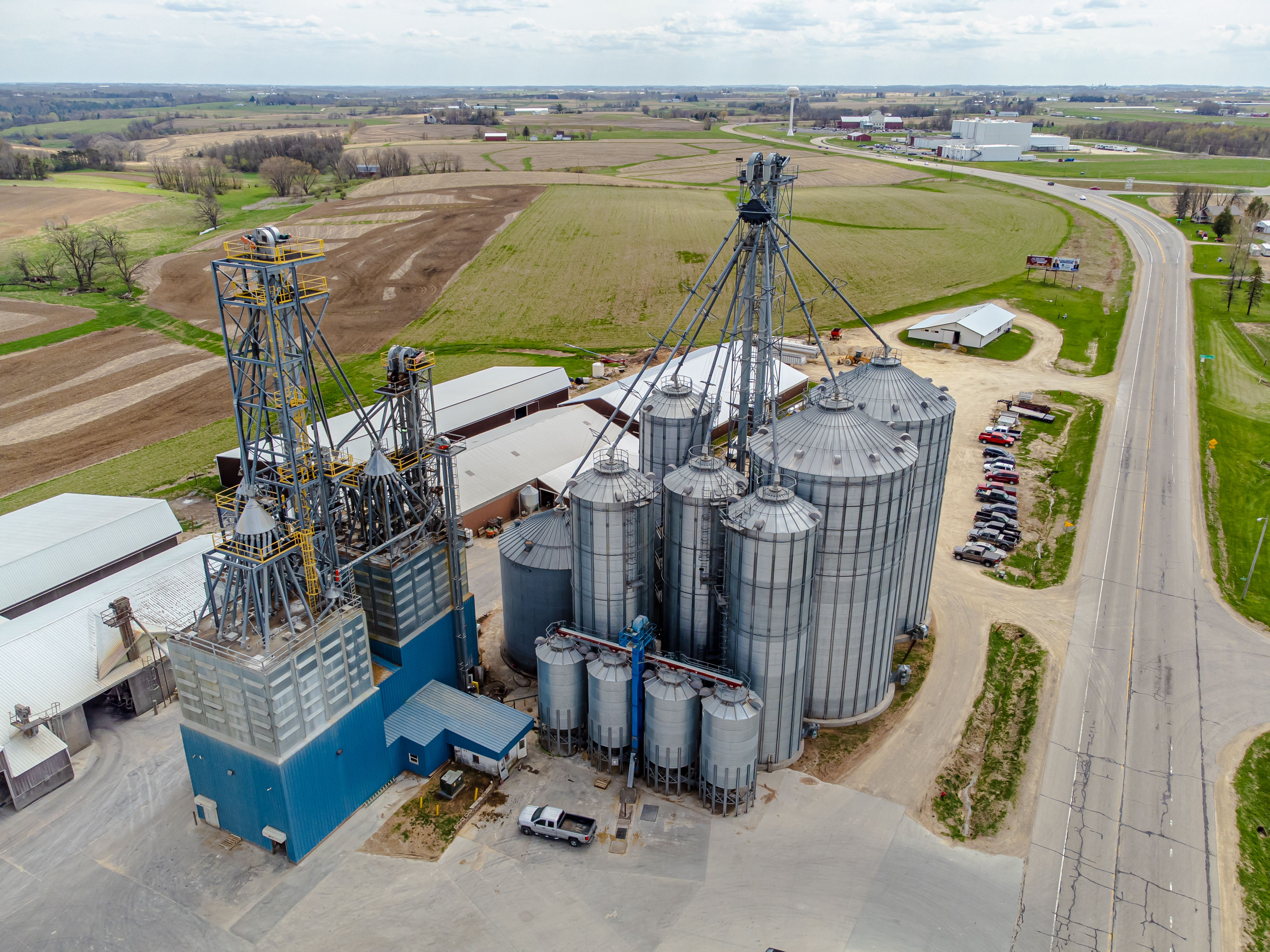 Grain silos provide a real-world application of solid geometry, as farmers must calculate volume for capacity and surface area for construction materials.