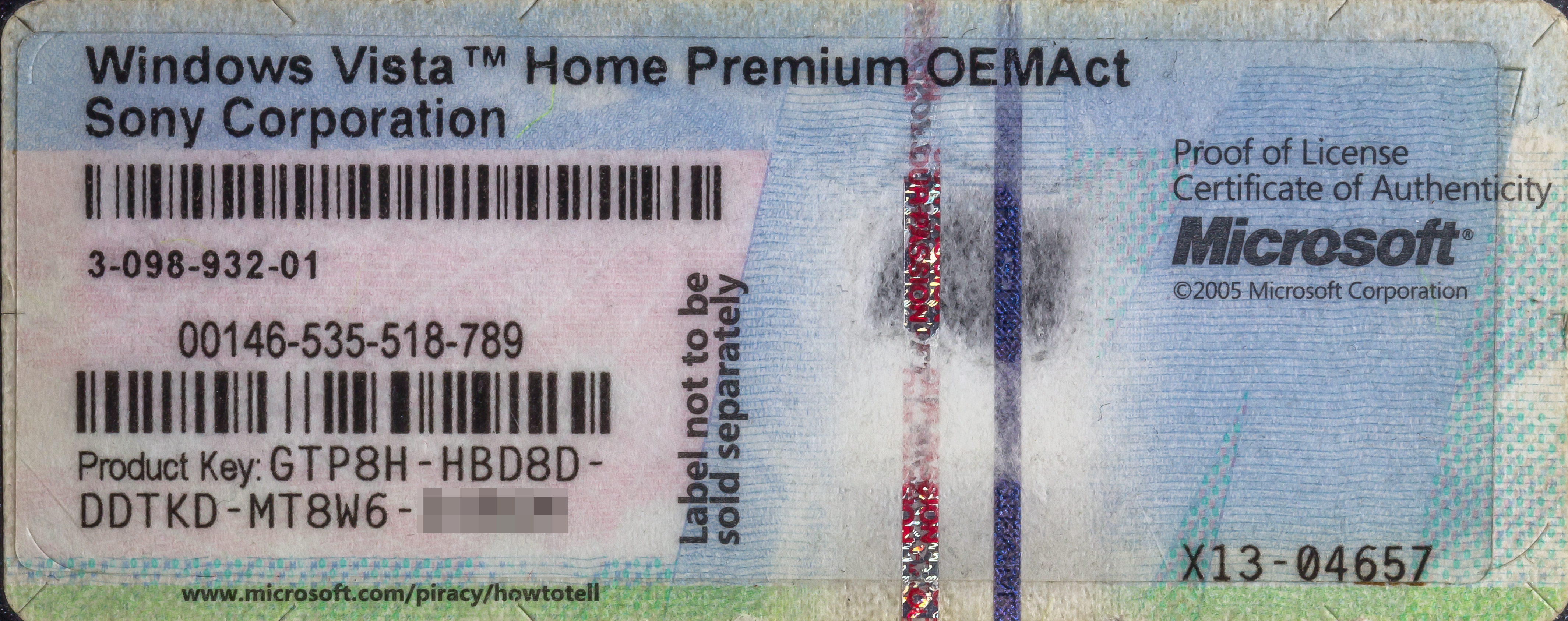A Certificate of Authenticity displaying a Windows product key. Entering a valid Pro product key into a Home edition device triggers an instant, in-place upgrade that unlocks advanced management features.