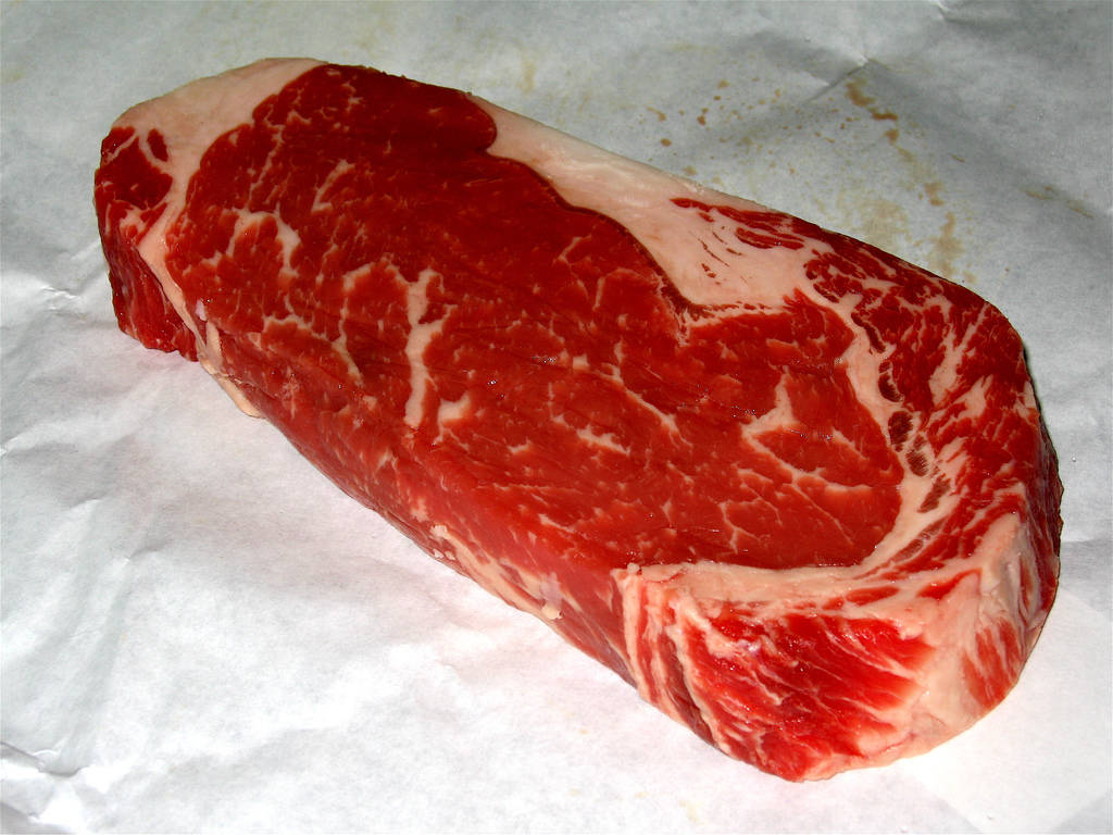 In the meat and bone analogy for commercial leases, the edible meat represents the tenant's usable square footage, while the heavy, inedible bone represents the building's loss factor.