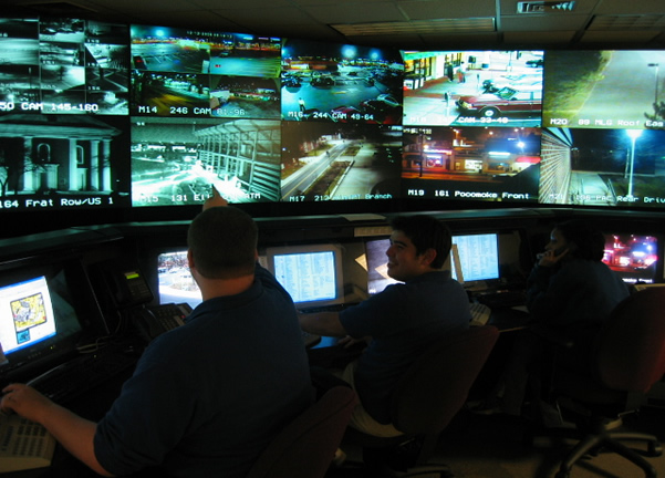 A typical Security Operations Center (SOC) environment where analysts monitor networks and systems, moving beyond high-level dashboards to investigate raw system data.