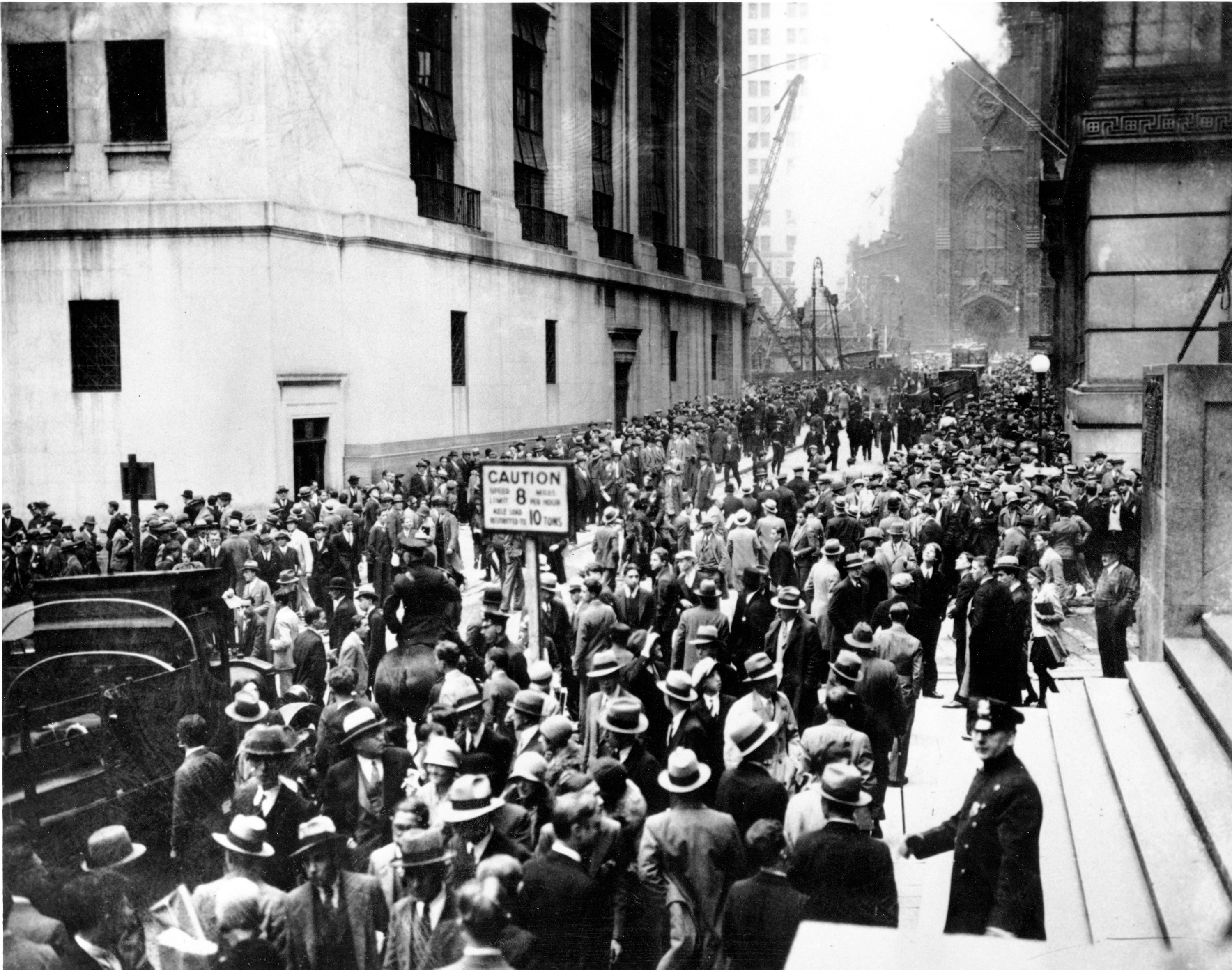 Investors gather outside the New York Stock Exchange during the 1929 crash. Market risk is the unavoidable, systemic threat that broad economic downturns will negatively impact the share price of all companies regardless of an individual corporation's performance.