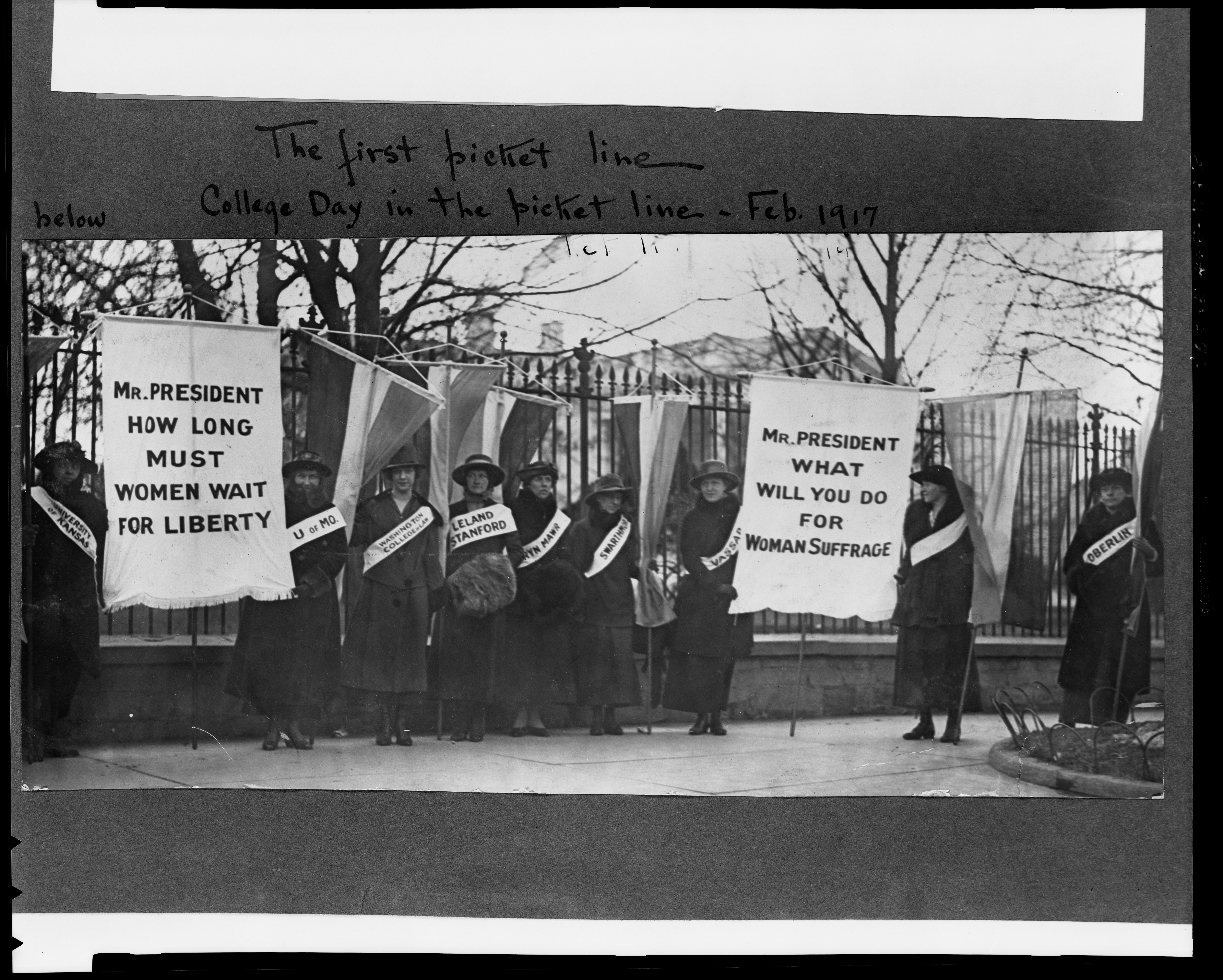 Women suffragists picketing the White House in 1917. This relentless grassroots campaigning eventually pressured the government to modernize its democratic mechanics by passing the Nineteenth Amendment.