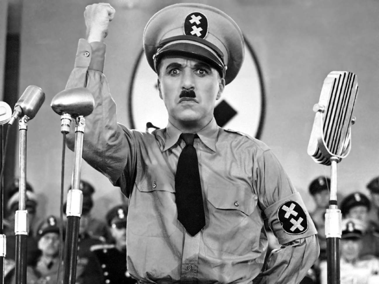 In his 1940 film "The Great Dictator," Charlie Chaplin weaponized exaggeration and mockery to satirize Adolf Hitler, demonstrating how humor can be used to attack dangerous societal or political figures.