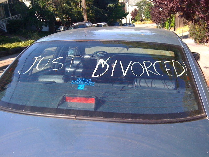 'JUST DIVORCED!' scrawled on a car window — divorce does not revoke a will outright; section 18A instead treats the ex-spouse as if they had died on the date of dissolution.