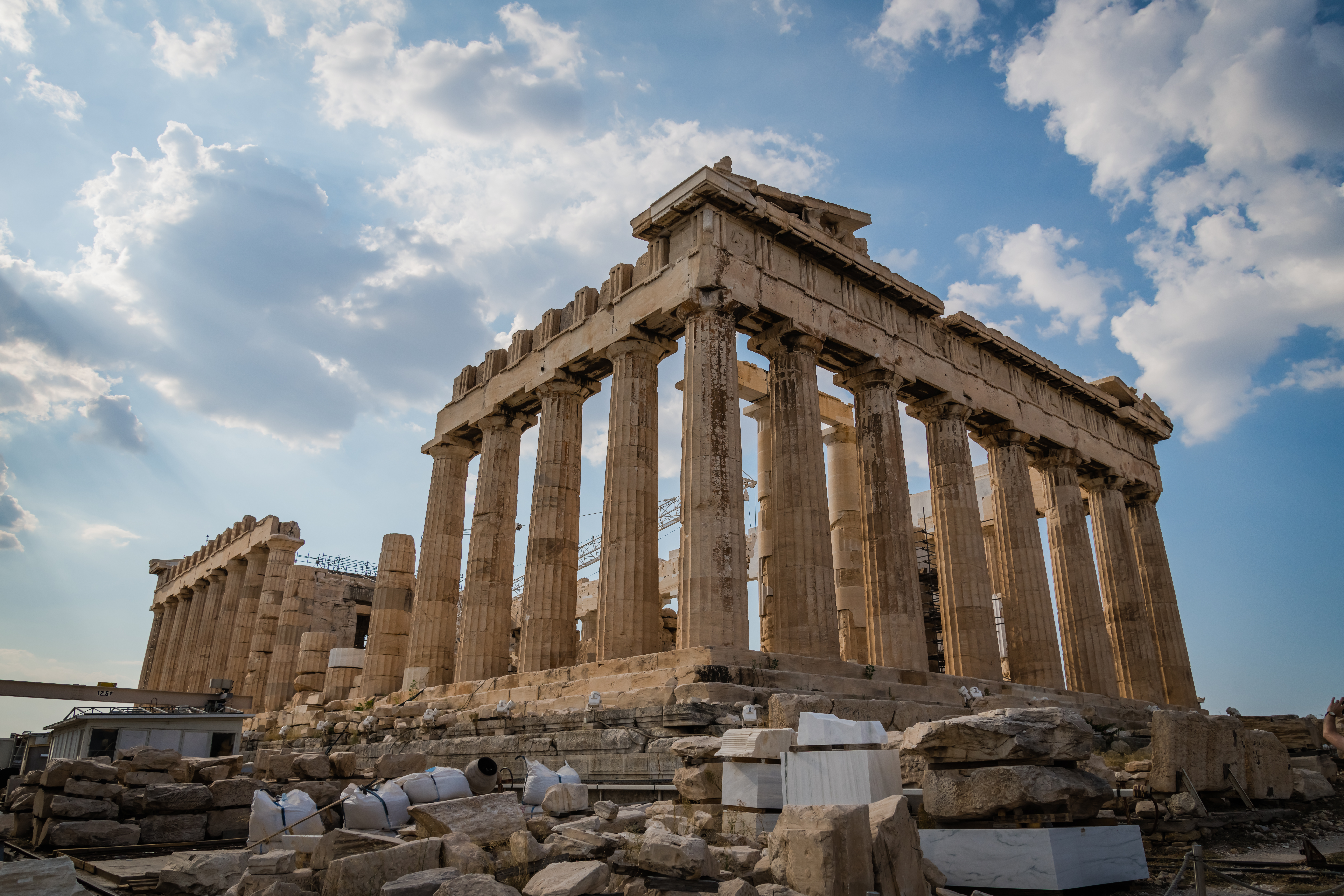 The Parthenon in Athens. Utilizing sturdy Doric columns, it stands as a pinnacle of the ancient Greek architectural obsession with proportional harmony and mathematical order.