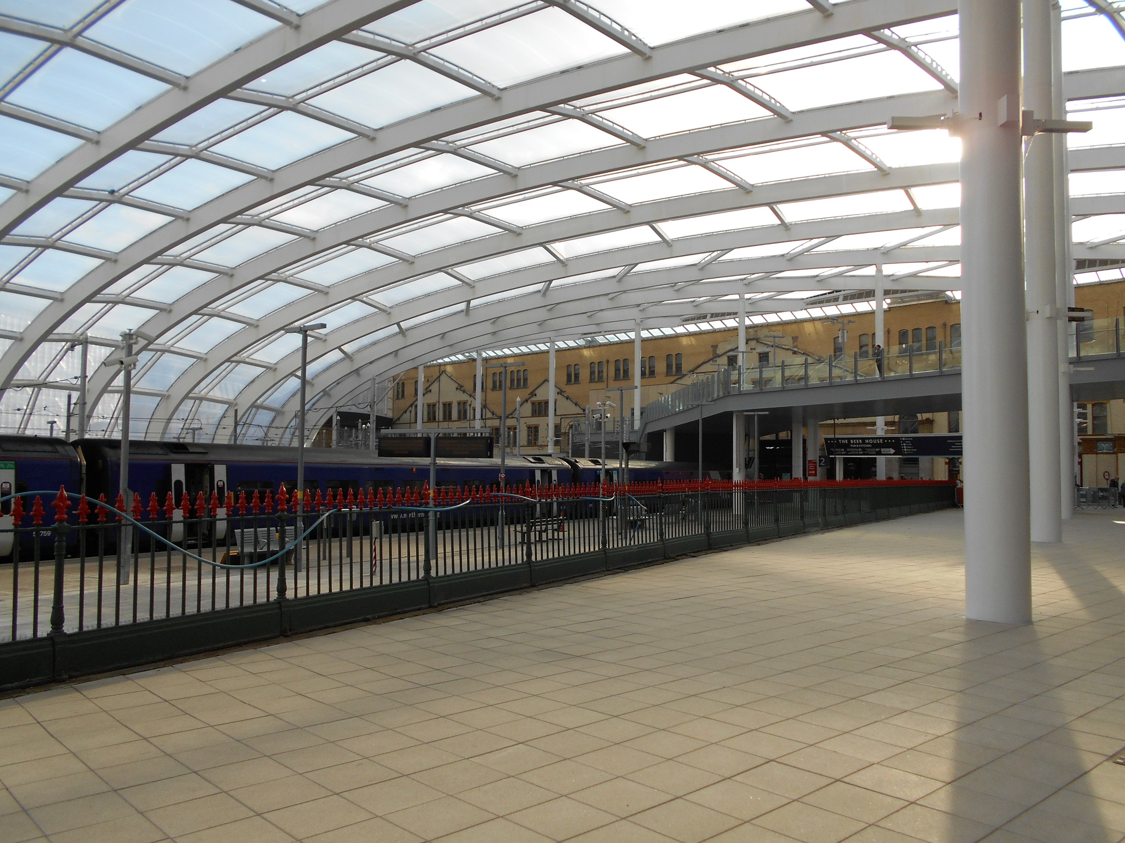A complex structural steel framework for a building roof, illustrating the physical magnitude of commercial construction projects that require a comprehensive structural blueprint to execute correctly.